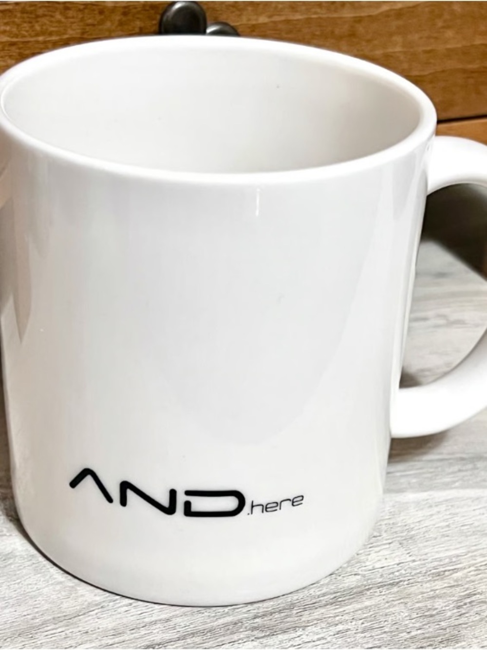 AND.here White Ceramic Coffee Mug with Logo